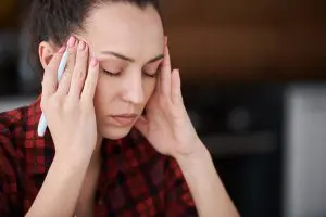 woman experiencing headache