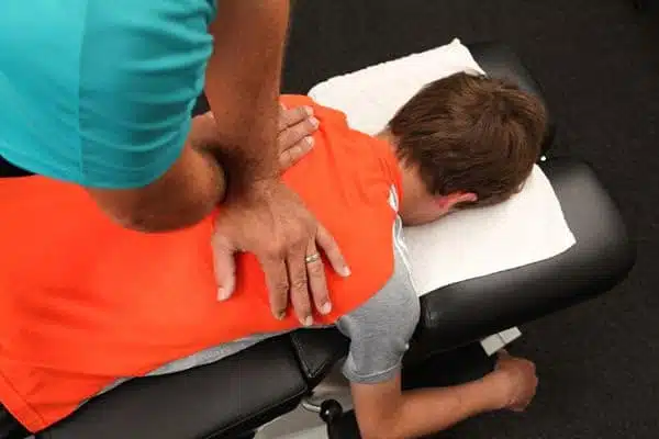 male patient getting chiropractic adjustment