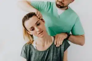 A specialist treating a patient's shoulder pain