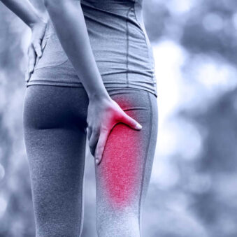 A Woman with Leg Pain from Sciatica seeking Treatment in Houston, TX